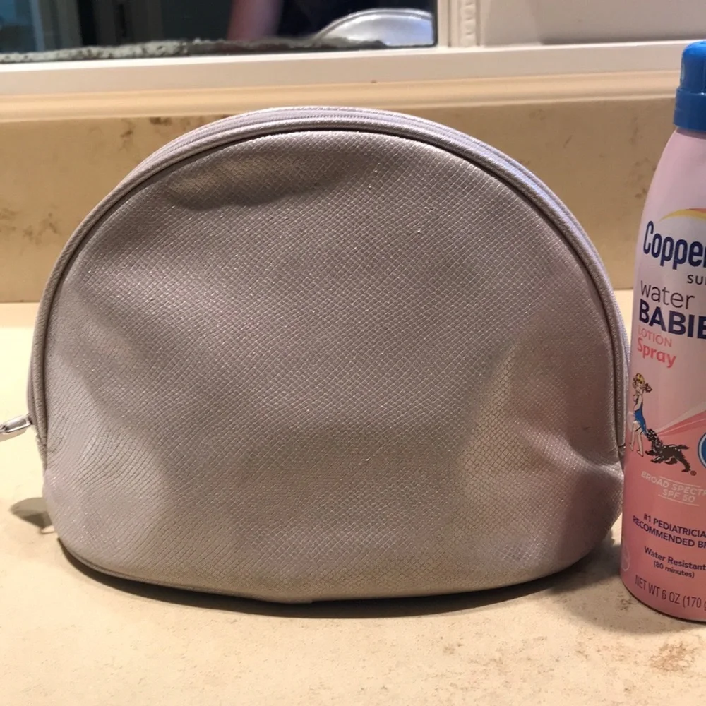 NWOT Orlane Paris taupe shiny cosmetic bag.